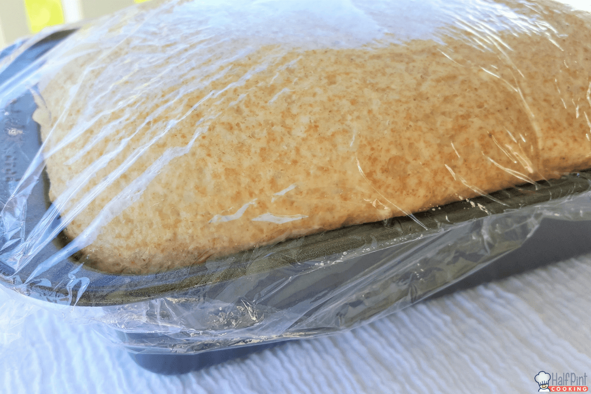 honey whole wheat bread-dough in pan